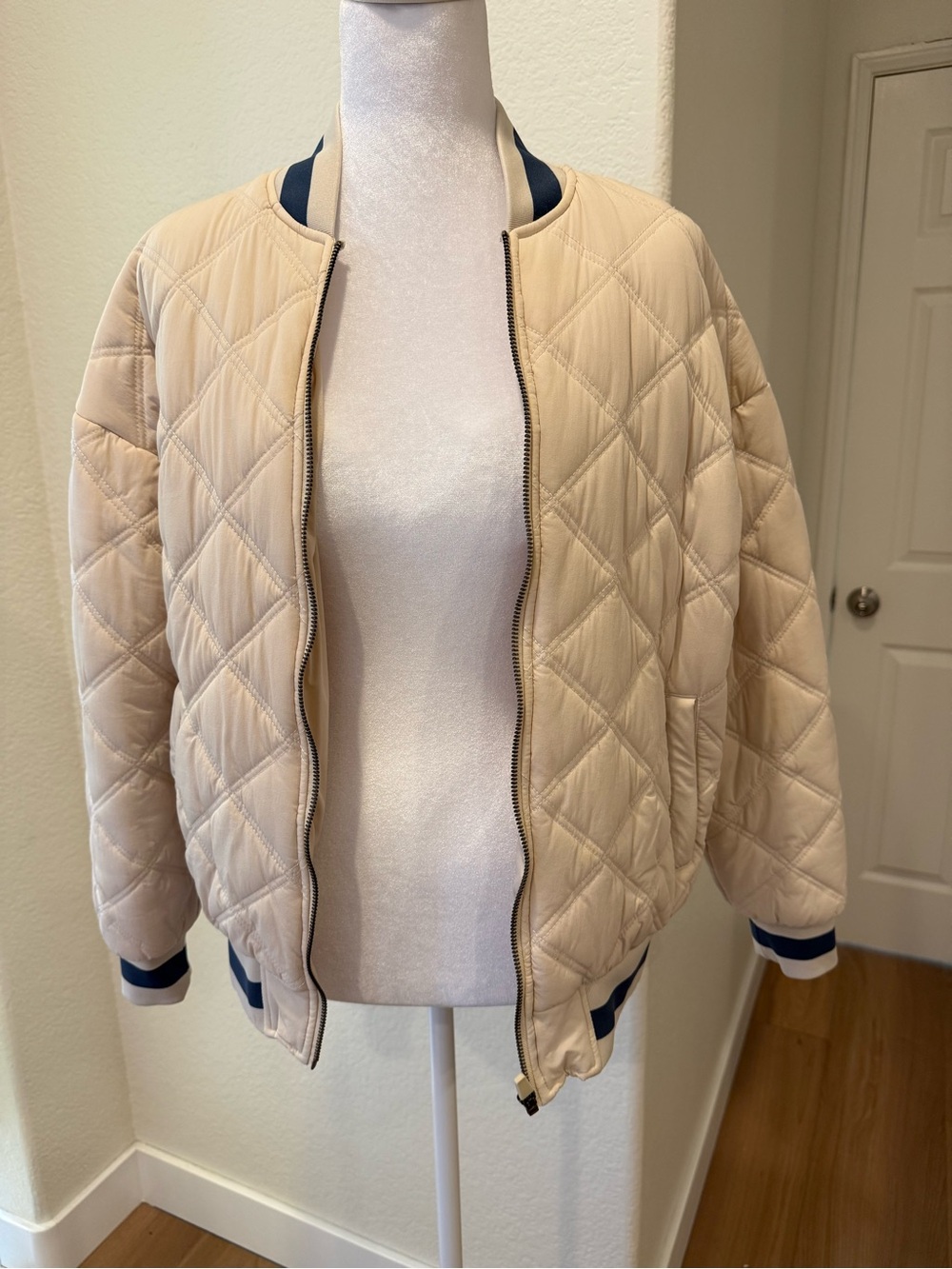 Glyder Quilted Bomber Jacket in Cream with Navy Trim